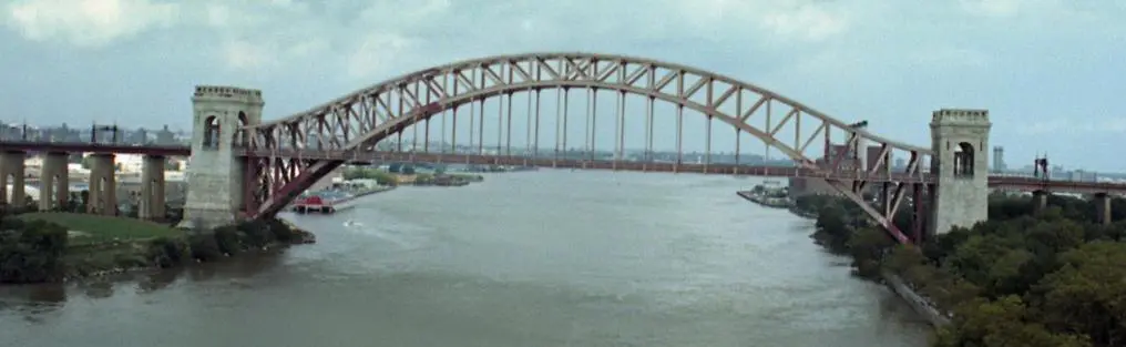 A large bridge over the water with a sky background